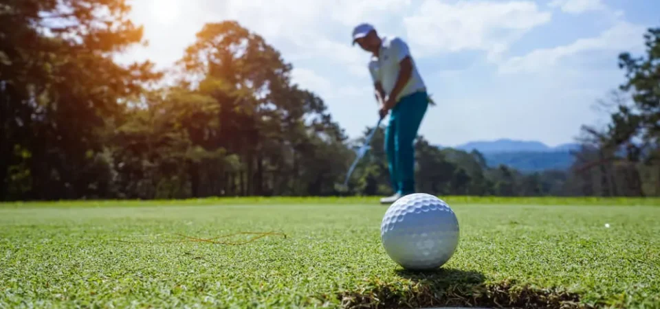 TEE OFF AT ORANGE BEACH GOLF COURSES .